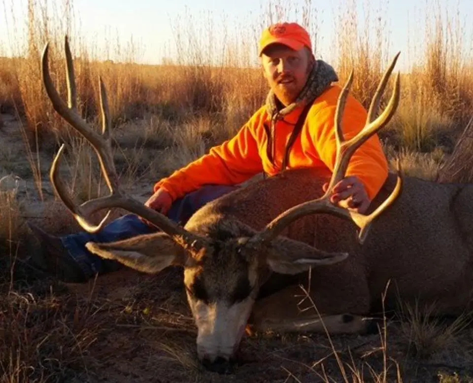 Hunter with a mule deer he hunted