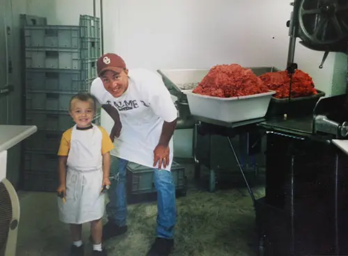 Picture of ted and his father in the meat proessing plant